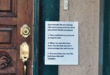 Training and reinforcement are how to stop a dog from darting out the door.