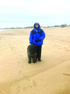 person standing with dog