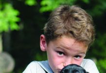 child holding puppy