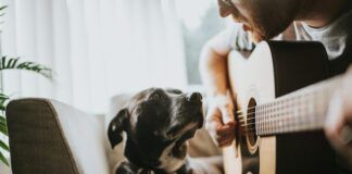 Singing to a dog.