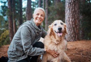 Shot of a senior woman out for a hike with her dog