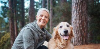 Shot of a senior woman out for a hike with her dog