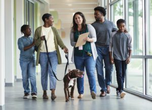 African-American family adopting dog from animal shelter