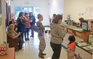 The lobby of an animal shelter crowded with people.