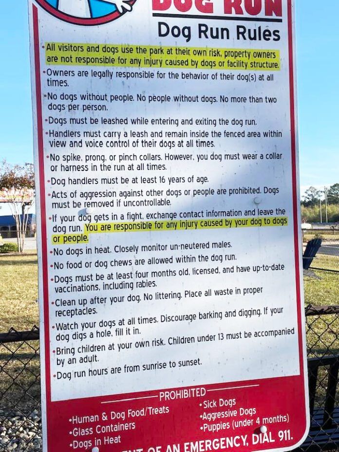 Dog park rules are often listed on signs like the one displayed here.