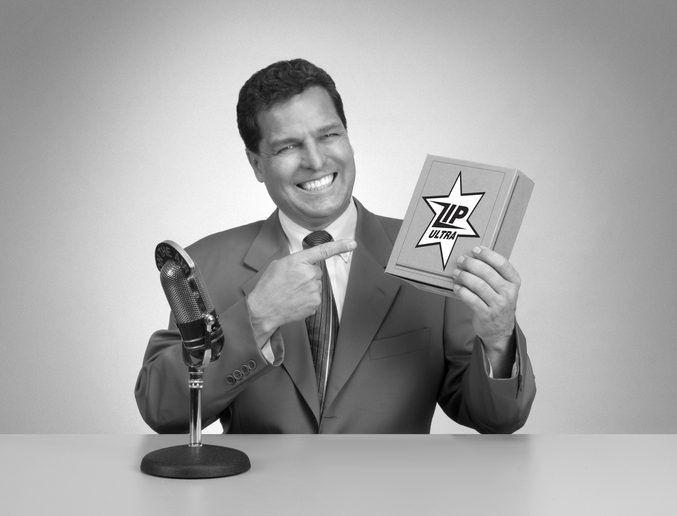 An old fashioned TV pitch man tries to sell a box of something.